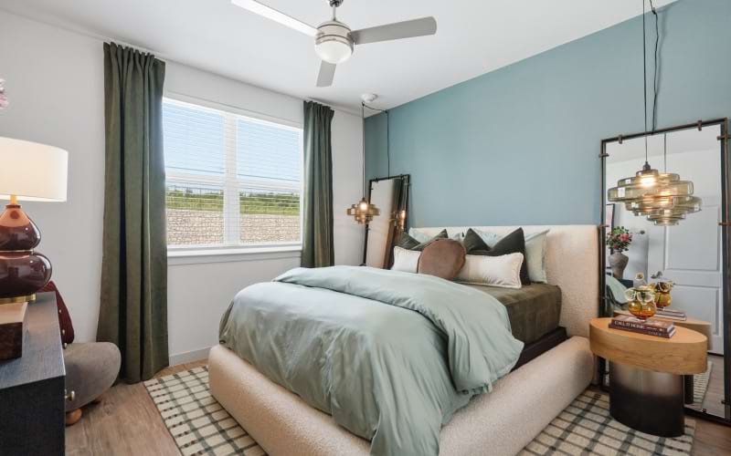 bedroom with side tables and large window