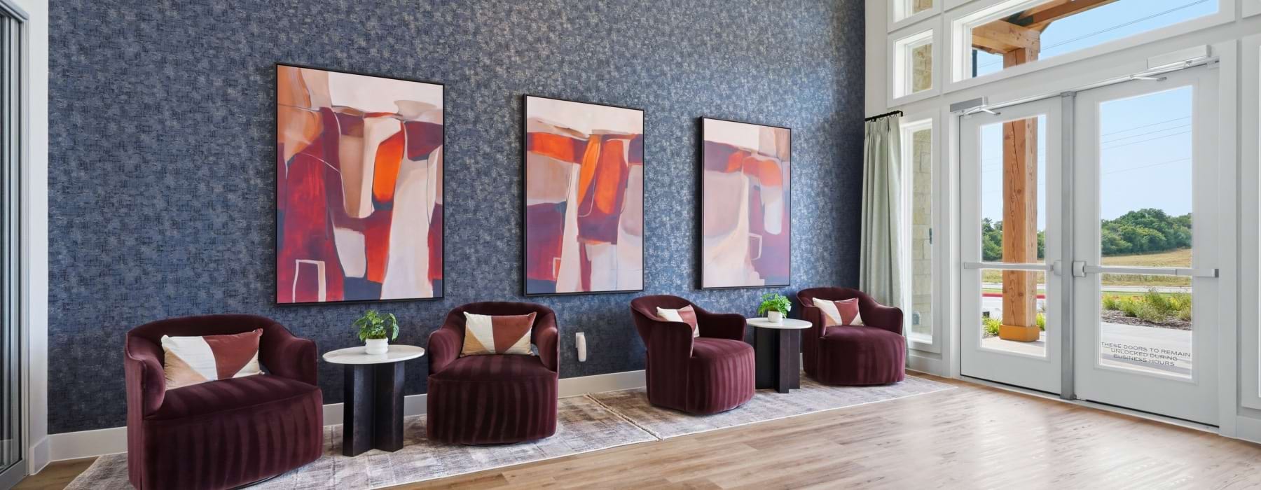 chairs, tables, floor to ceiling windows and lobby