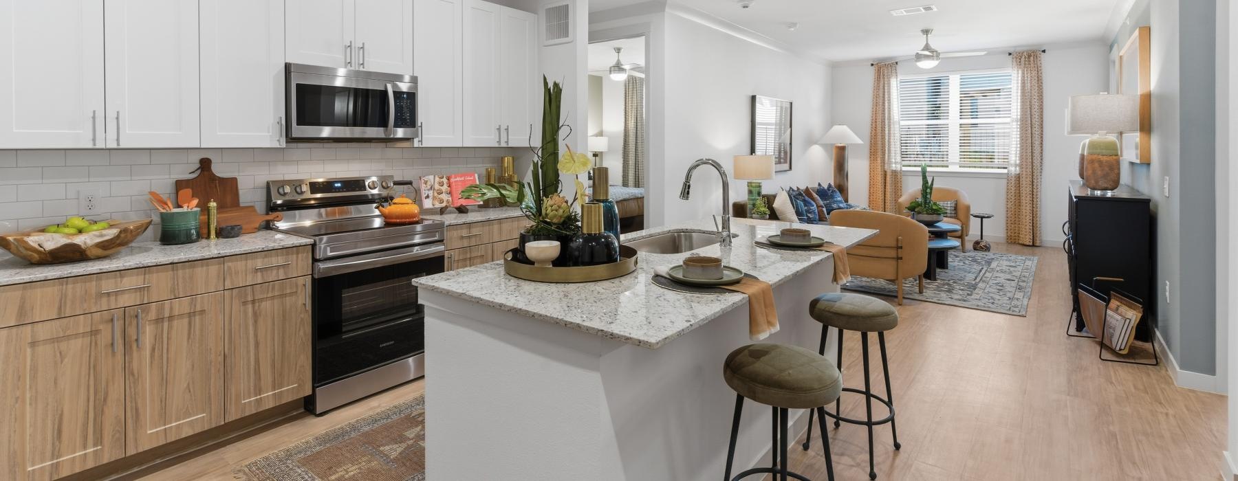 a kitchen with a marble island