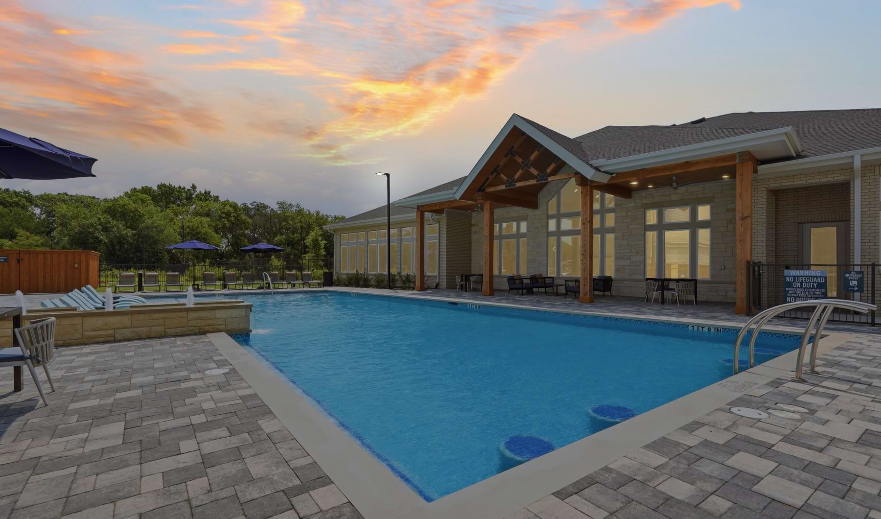 pool with chairs and side tables