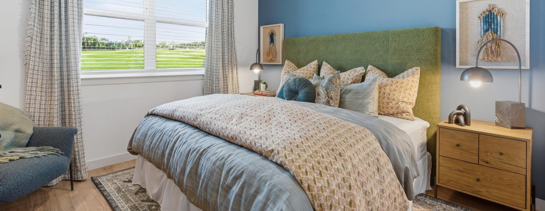 a bedroom with a bed and a fan