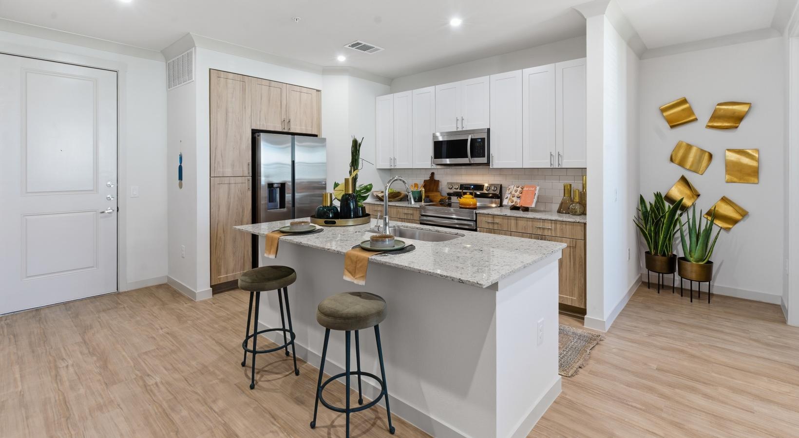 a kitchen with white cabinets