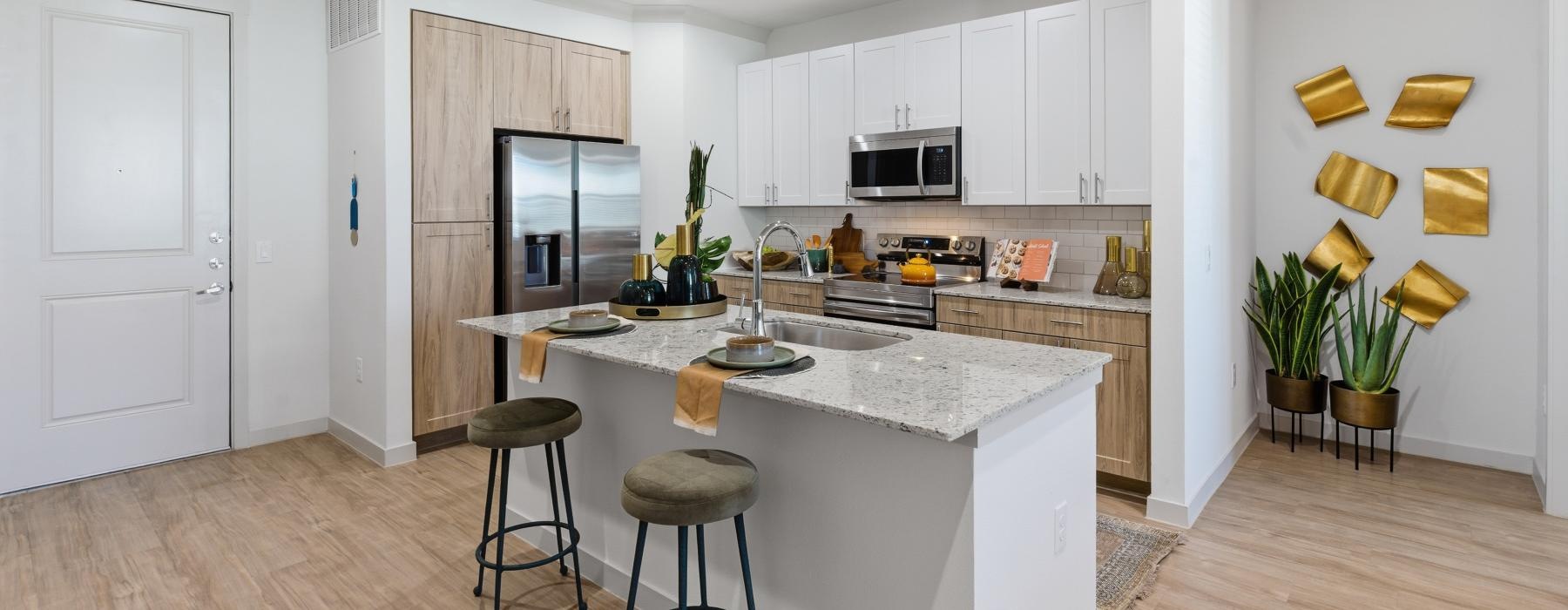 a kitchen with white cabinets