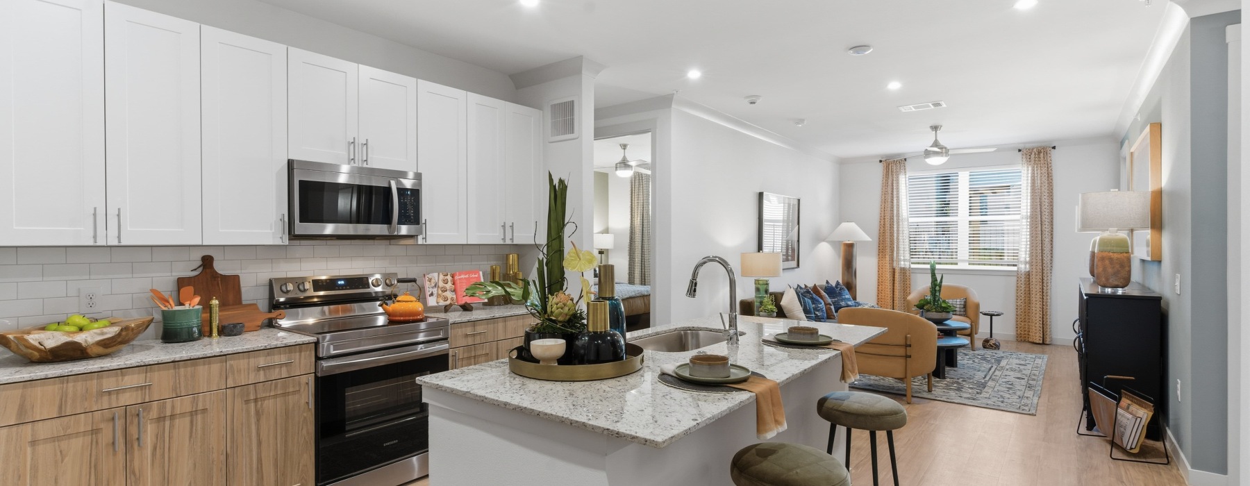a kitchen with a marble island