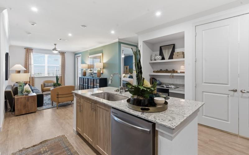 a kitchen with a marble island