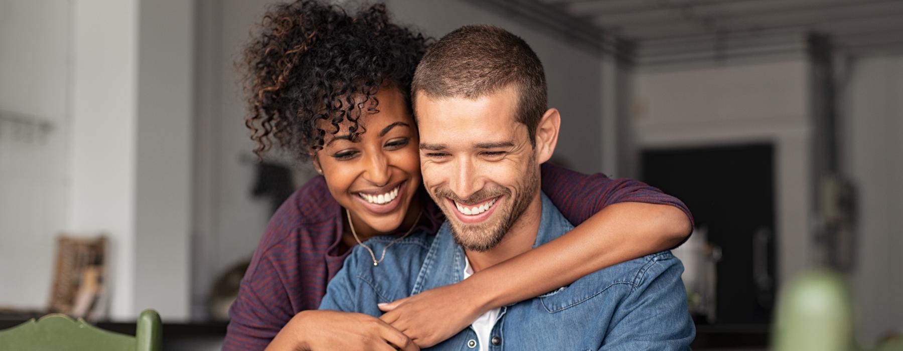 a man and a woman looking at a phone