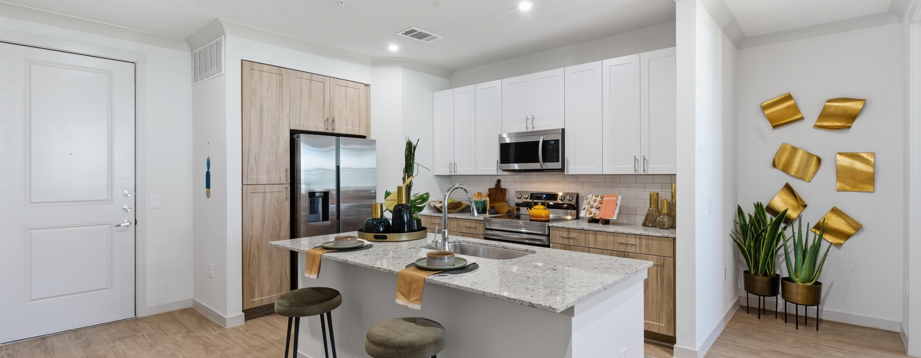 a kitchen with white cabinets